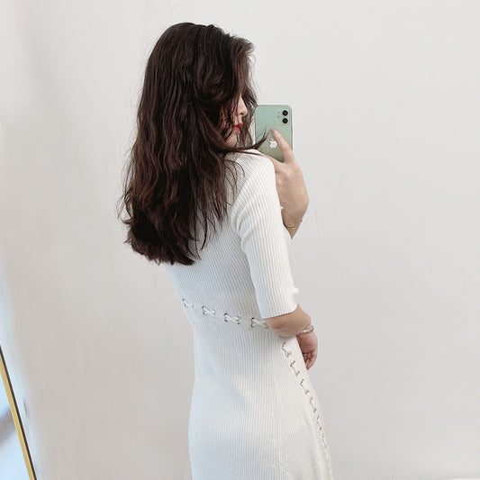 French knitted dress with a socialite style slit and five quarter sleeves, paired with a base skirt