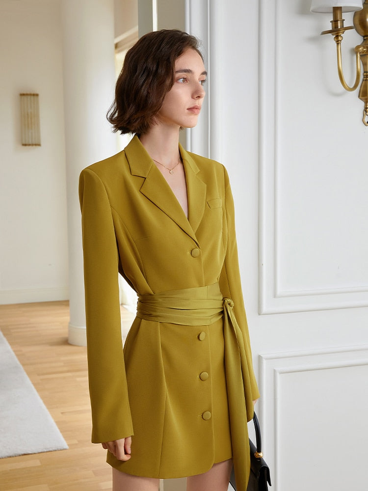 Women’s yellow blazer dress by eprolo with lapel collar, long sleeves, belted waist, loose fit, ideal for spring and autumn fashion.