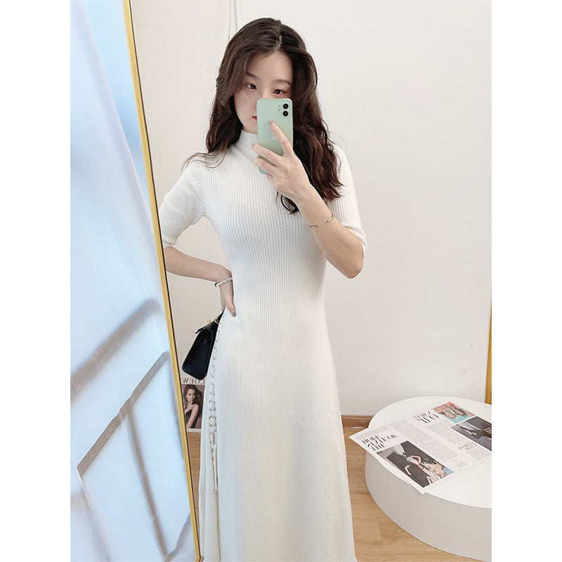 French knitted dress with a socialite style slit and five quarter sleeves, paired with a base skirt